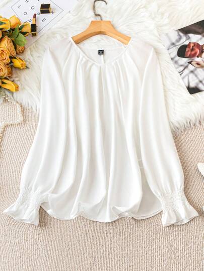 A white blouse with a unique design