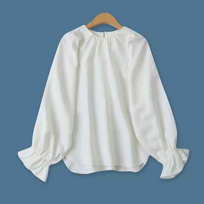 A white blouse with a unique design
